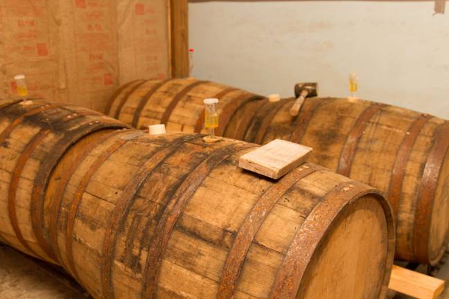 Locals brew up first NJ hard cider company Whiskey barrels inside the fermentation chamber.