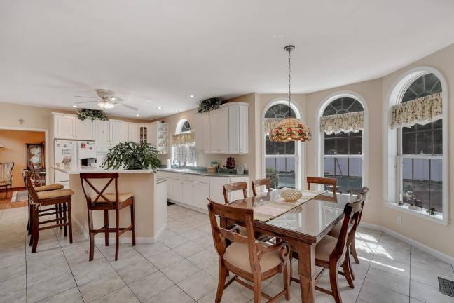 Modern, elegant four-bedroom home with privacy and a pool Kitchen and breakfast nook