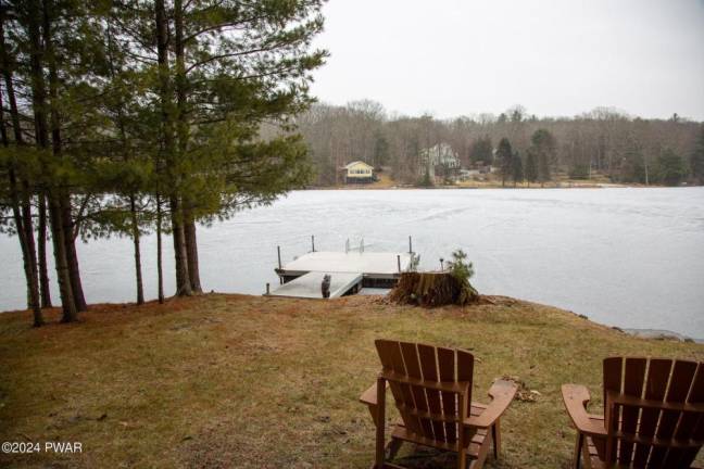 Lakefront home features private dock and custom furnishing