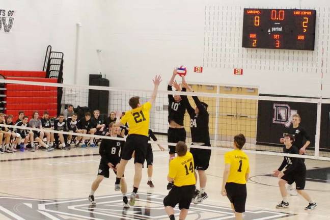 Delaware Valley Warriors top Lake-Lehman Black Knights Hands above the net aim for the ball
