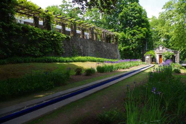 A walk through history A reflecting pool leads to The Bait Box on the grounds of Grey Towers.