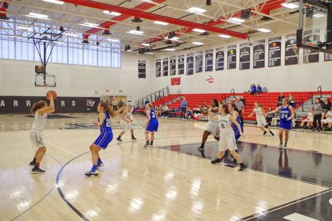 Lady Cougars top Lady Warriors in holiday basketball tourney The Delaware Valley Warriors and the Kittatinny Cougars maneuver on the court. Photo by George Leroy Hunter)
