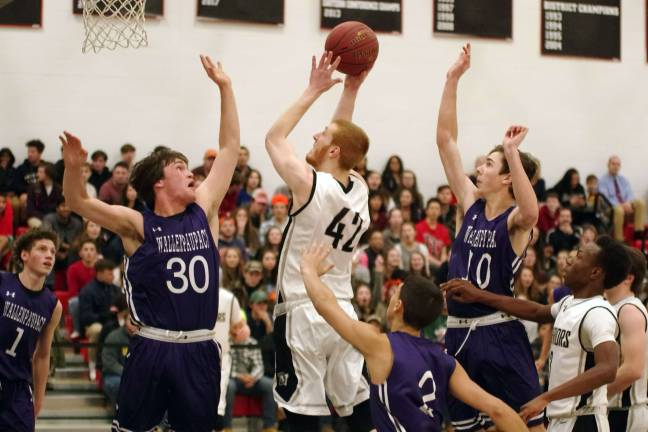 Delaware Valley Warriors hold off Wallenpaupack Buckhorns Delaware Valley's Matthew Campbell (42) in the midst of a shot in the first period. Campbell scored four points. (Photo by George Leroy Hunter)