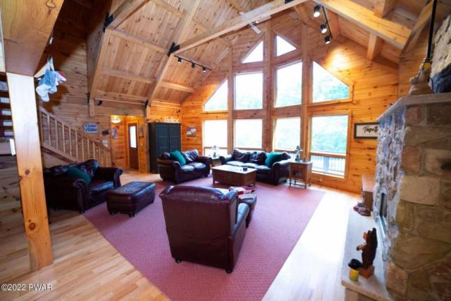 Furnished, spacious log and stone cabin is move-in ready