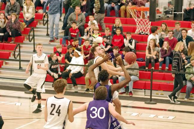 Delaware Valley Warriors hold off Wallenpaupack Buckhorns Delaware Valley's Dylan Kelly leaps carrying the ball towards the hoop in the third period. Kelly scored twelve points. (Photo by George Leroy Hunter)