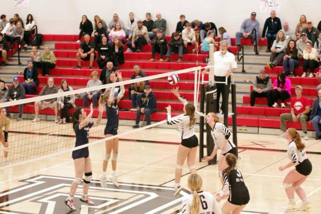 The Delaware Valley Warriors and the Spring-Ford Rams face each other on the court.