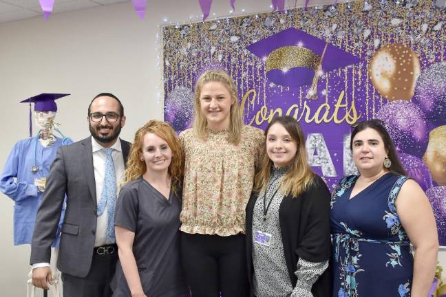 Medical assistant training program through Wayne Memorial Community Health Centers begins First graduates of medical assistant program. Shown left to right, Ebi Rowshanshad, DO, family practitioner, Hamlin Family Health Center; Kristen Knash, CMA, Highland Physicians Family Health Center and WMCHC site facilitator for NIMAA; Julia Pizzo, WMCHC’s first NIMAA graduate; Victoria Purdy, Human Resources, WMCHC and program coordinator for NIMAA; Maria Emiliani, CMA, Hamlin Family Health Center and preceptor for NIMAA.
