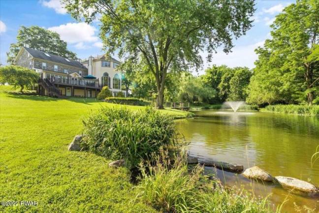 Stone farmhouse on 29+ acres with pond, pool, stables and more Stone farmhouse on 29+ acres with pond, pool, stables and more