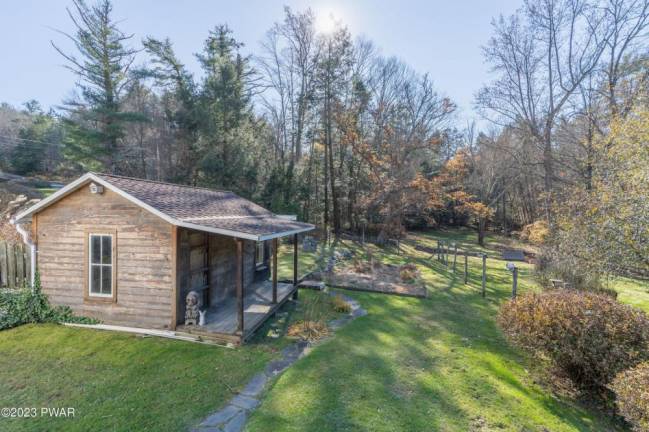 Brook-front farmhouse has lots of character