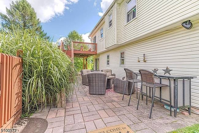 Fruit trees, pool, and gleaming hardwood floors are among this home’s amenities