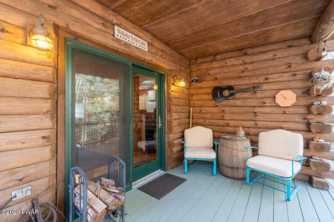 Custom log home offers lake access and privacy