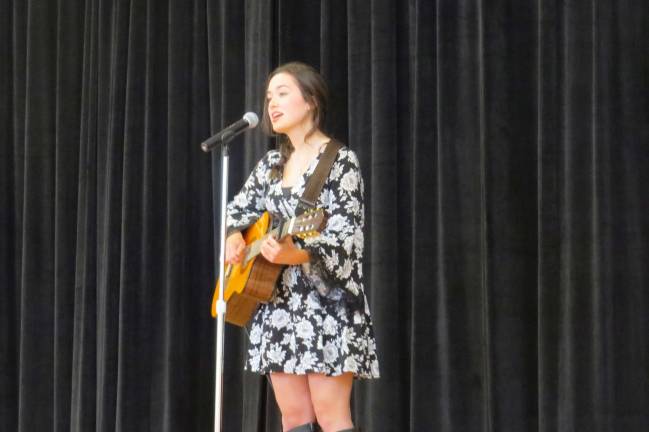 Third graders write out their 'heart songs' Sarah Hawthorne from DVHS plays for the third graders (Photo by Peg Snure)