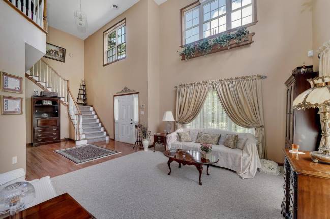 Modern, elegant four-bedroom home with privacy and a pool Living room