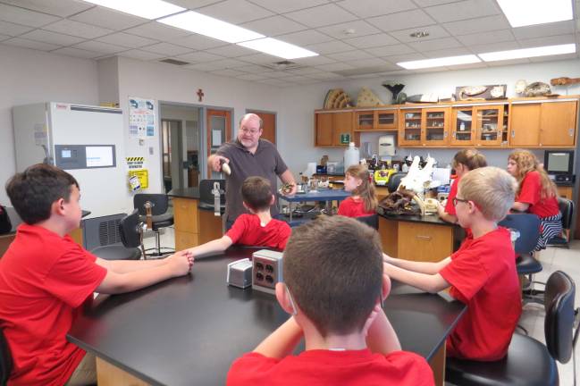 DVE-News/TV reporters meet Misericordia University president Dr. Serine, Science Professor, showed us many different mammal skulls, snakes, even tapeworms (Photo by Peg Snure)
