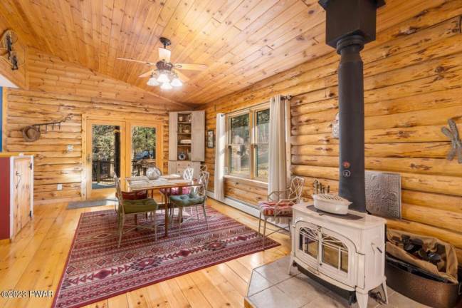 Custom log home offers lake access and privacy