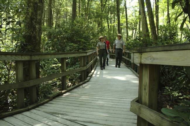 It’s no trick: Dingmans Falls reopens on Oct. 31 Rangers on the walkway to the bottom of the falls after repairs (Photo by Pamela Chergotis)
