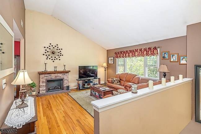 Fruit trees, pool, and gleaming hardwood floors are among this home’s amenities