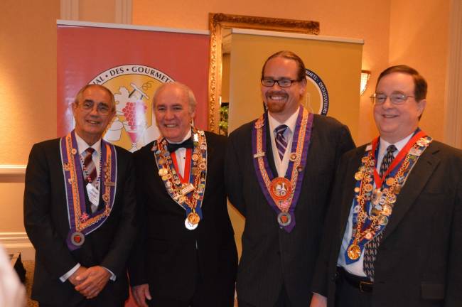 Ready to celebrate with Gold Medal winner Christopher Bates, second from right, are, from left, head of the judges panel Brian Julyan, Chief Executive of the Court of Master Sommeliers of Europe, and, representing the U.S. Cha&#xee;ne des R&#xf4;tisseurs, Grand Echanson Bruce Nichols and Vice Echanson National Charlie Bennett.