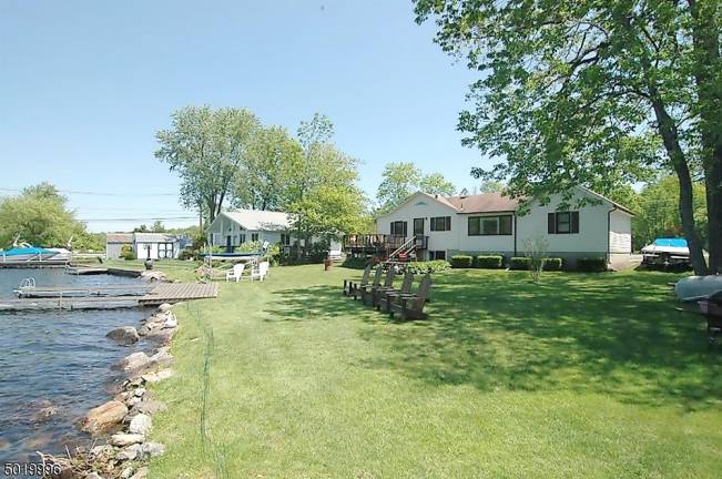 Three-bedroom ranch offers 100 feet of level lakefront Three-bedroom ranch offers 100 feet of level lakefront