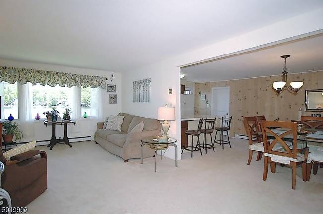 Three-bedroom ranch offers 100 feet of level lakefront Three-bedroom ranch offers 100 feet of level lakefront