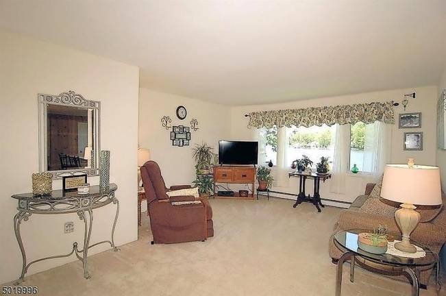 Three-bedroom ranch offers 100 feet of level lakefront Three-bedroom ranch offers 100 feet of level lakefront
