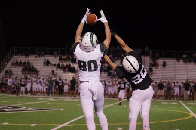 Pennridge receiver Connor Pleibel makes a leaping catch while covered by Delaware Valley defensive back Preston Machado in the fourth quarter. Pleibel was able to run and cross the goal line for a touchdown when Machado fell during the play. Pleibel produced 119 receiving yards.