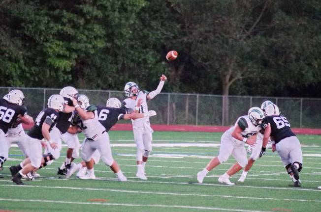 In the first half Pennridge quarterback Bobby Croyle throws the ball just before Delaware Valley linebacker Jason Henderson (6) reaches him. Croyle threw for one touchdown and completed 11 of 16 passes for 167 yards.