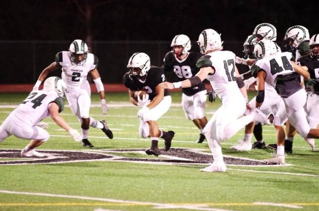 Delaware Valley ball carrier Josh Balcarcel (2) is pursued by Pennridge defenders during the second quarter.