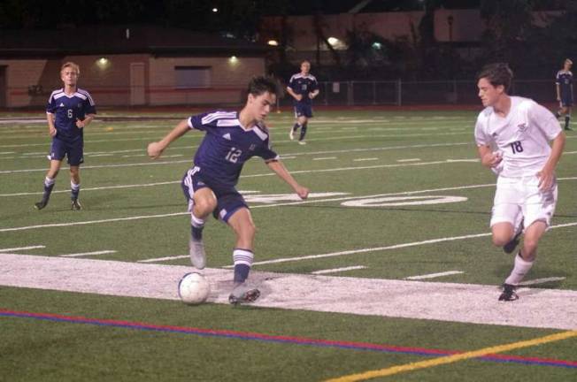 Abington Heights defeats DV in boys soccer Abington's Luke Abdalla controls the ball as Delaware Valley's Isaac Yost approaches in the second period. Abdalla scored two goals. (Photo by George Leroy Hunter)