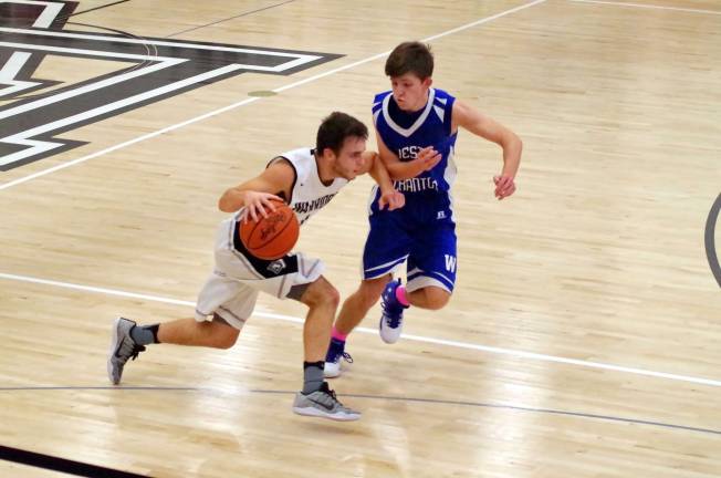 Delaware Valley Warriors meet West Scranton Invaders in 'Court Battle' Delaware Valley’s Dylan Kelly tries to dribble the ball past West Scranton’s Blake Carlton. (Photo by George Leroy Hunter)