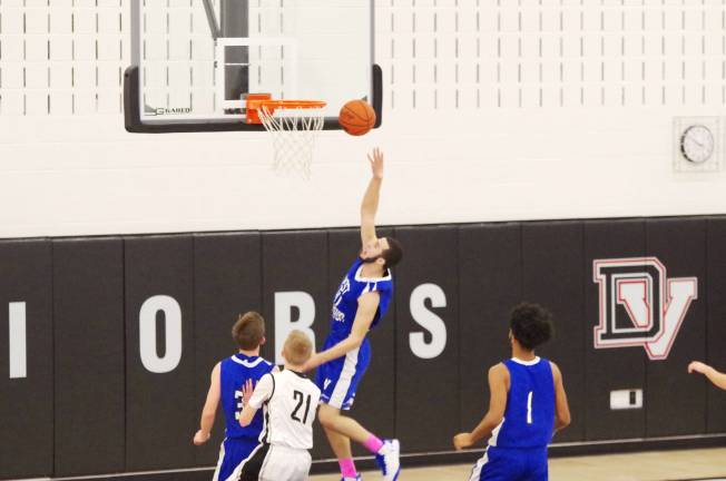 Delaware Valley Warriors meet West Scranton Invaders in 'Court Battle' West Scranton’s Matt Williams tosses the ball towards the basket. Williams scored 15 points. (Photo by George Leroy Hunter)