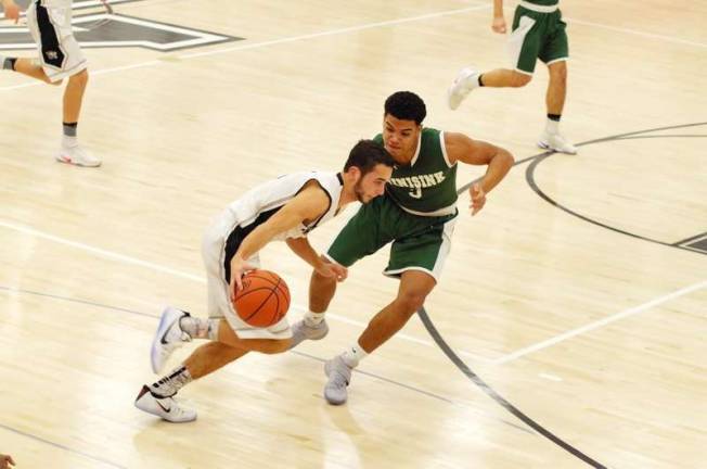 DV Warriors defeat Minisink Valley in holiday tournament Delaware Valley's Rory Matz dribbles the ball while covered by Minisink Valley's Carlos Forde.