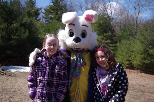 Easter egg hunt Twelve year old Mariah Kennedy and eight year old Jazmin Morgan of Port Jervis, N.Y. pose with the Easter Bunny.