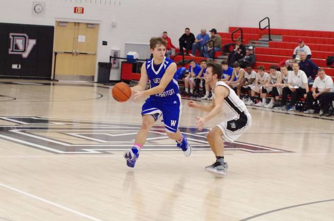 Delaware Valley Warriors meet West Scranton Invaders in 'Court Battle' West Scranton’s Cole Stetzar dribbles the ball while Delaware Valley’s Dylan Kelly keeps pace. Stetzar scored 11 points. (Photo by George Leroy Hunter)