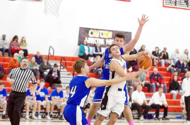 Delaware Valley Warriors meet West Scranton Invaders in 'Court Battle' West Scranton defenders converge on Delaware Valley’s Dylan Kelly during a shot attempt. (Photo by George Leroy Hunter)