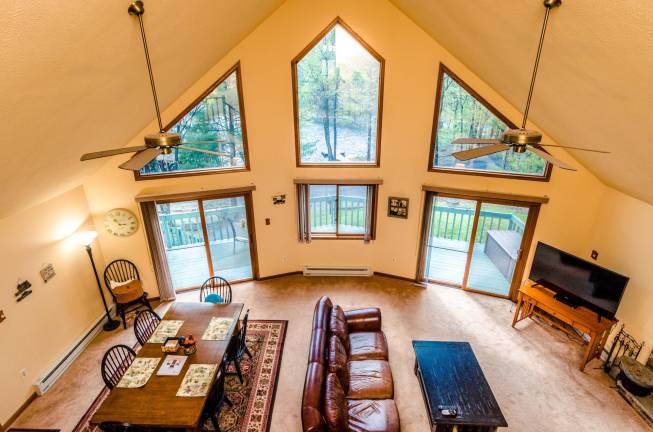 Tri-level chalet has prime lakefront location Living room
