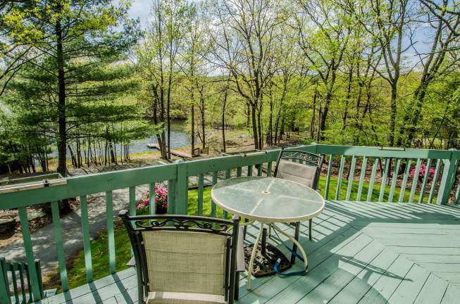 Tri-level chalet has prime lakefront location Deck