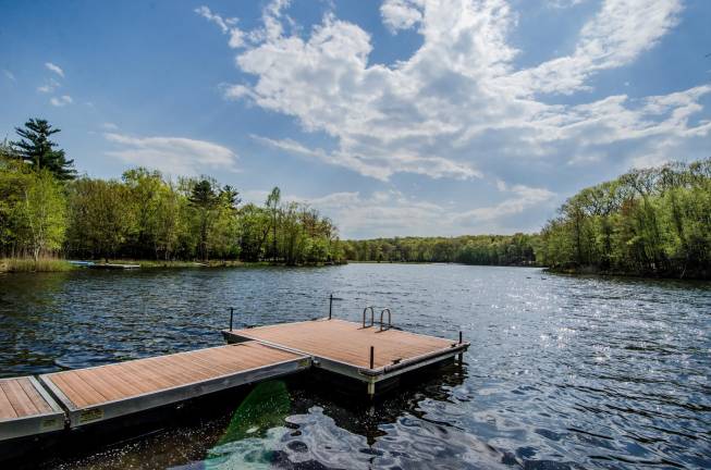 Tri-level chalet has prime lakefront location Dock