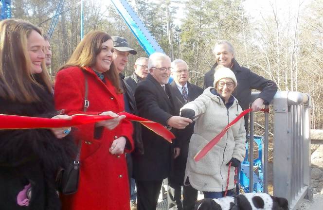 The ribbon is cut at the newly refurbished Mott Street Bridge