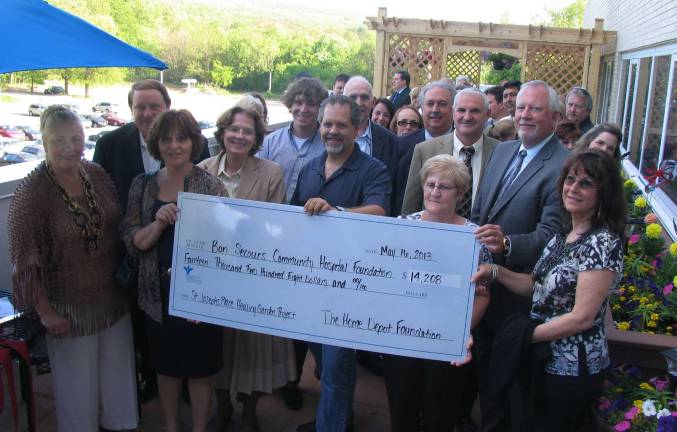 Healing Garden created at St. Joseph’s Place Prior to the ribbon cutting the Home Depot Foundation continued to demonstrate its generosity by presenting a check for $14,208 to the Bon Secours Community Hospital Foundation.