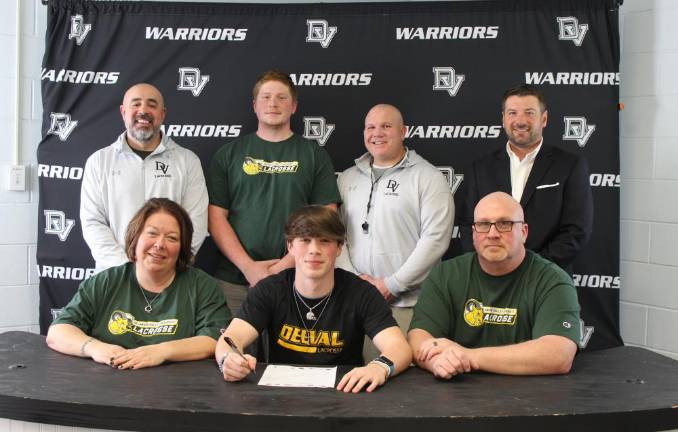 L-R Front: Blennie Kelly, Owen Kelly, and Kevin Kelly. L-R Back: Assistant lacrosse coach Daniel Gonzalez, Logan Kelly (brother), head lacrosse coach Jeff Krasulski, and true lacrosse coach Chris Hoffman.