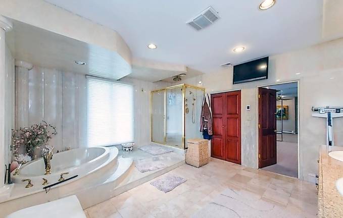 Custom estate includes car charging station, hot yoga room, and frescos Custom estate includes car charging station, hot yoga room, and frescos