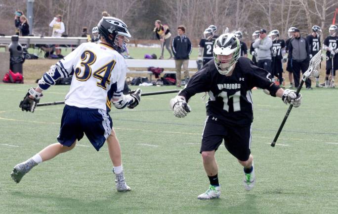 Delaware Valley lacrosse team loses to Vernon Delaware Valley's Jed Daniel (11) maneuvers around Vernon's Brian Moran (34).