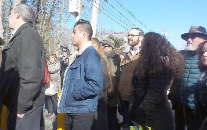 A crush of people listen to Pike County Commissioner Matt Osterberg and Milford Mayor Sean Strub