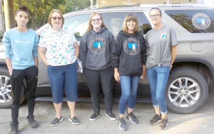 Selina McGinnis (far left) and Janet Heim (second from left) stood outside borough hall with Hound Hunters of Pennsylvania, which finds lost animals and do their best to return them to their owners. (Photo by Frances Ruth Harris)