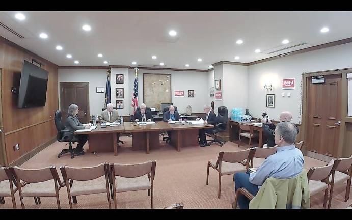 Pictured from left to right are: Clerk Krista Gromalski, Commissioner Ronald R. Schmalzle, Commissioner Matthew M. Osterberg, Commissioner Tony Waldron, and County Solicitor Thomas F. Farley. Photo by Meghan Carlson.