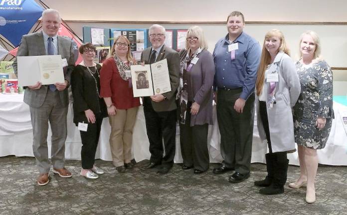 Pictured at the awards dinner (from left) are task force members: Pike County Commissioner Ronald Schmalzle, Kelly Stagen of Hemlock Farms Conservancy, Task Force Chair Rosemarie Schoepp of Kids Play Today, Pike County Commissioner Matthew Osterberg, Dr. Cathleen Mattos of Dingmans Medical Center, Task Force Liaison Brian Snyder of the Pike County Planning Office, Jill Gamboni of Rep. Michael Peifer's Office, and Michele Long of the Pike County Conservation District.