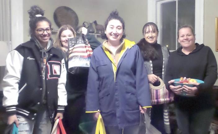 Members of the Girl Scouts in the Heart of Pennsylvania (GSHPA) Troop 52735 were on hand to pack care packages for the homeless. Volunteers carried them in their cars to distribute to any homeless person they found. They also had sleeping bags for anyone they found outside who did not want to come inside. From left are Ciara Valerio, Meghan Delaney, Zoe, and Laura and Doreen Delaney.