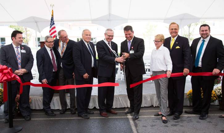 Orange Regional expands with new cancer center, office building On Sept. 19, Orange Regional Medical Center and Orange Regional Medical Group held a ribbon-cutting ceremony in celebration of the official opening of the new Physician Office Building and Spagnoli Family Cancer Center. Pictured (from left): Stephen J. Sugrue, VP, Compliance, Real Estate and Audit, GHVHS; Dr. Jeffrey Stewart, Medical Director, Cancer Center Representative; Dr. James Oxley, Orange Regional Medical Group; Terry Olivo, ORMC Chairman, Board of Directors; Darrell Supak, GHVHS Chairman, Board of Directors; Scott Batulis, President and CEO, GHVHS; Aileen Gunther, New York State Assemblywoman; John Bonacic, New York State Senator and Dan Depew, Town of Wallkill Supervisor. Not pictured isMadeline Spagnoli. (Photo provided)