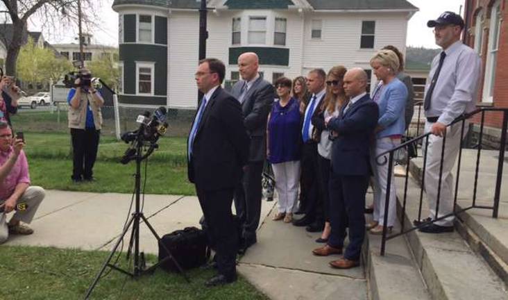 Judge: 'The story of Eric Frein ends today' Pike County District Attorney Ray Tonkin, with First Assistant District Attorney Bruce DeSarro at his side, speaks to the press after Thursday's sentencing hearing. Among those pictured behind them are Darla Dickson, Cpl. Bryon Dickson's mother; Major George L. Bivens; Tiffany Dickson, Cpl. Dickson's wife; Trooper Alex Douglass and his fiancee; and Bryon Dickson, Cpl. Dickson's father (Photo by Marilyn Rosenthal)